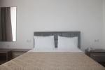 Кровать или кровати в номере Ventura Hotel