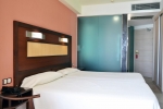 Кровать или кровати в номере Hotel Benikaktus