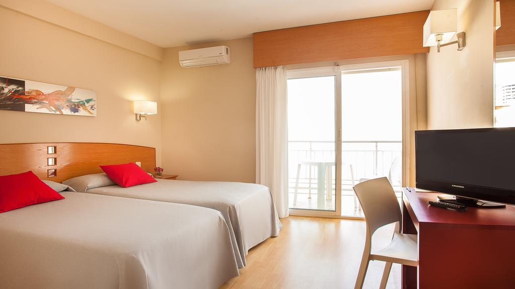 Кровать или кровати в номере Hotel RH Sol