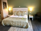 Кровать или кровати в номере Dion Palace Resort and Spa