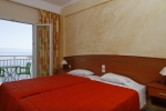 Кровать или кровати в номере Corfu Maris