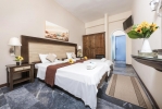 Кровать или кровати в номере Potamaki Beach Hotel