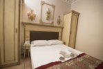 Кровать или кровати в номере Parthenon Art Hotel