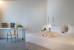 Кровать или кровати в номере Caravel Suites - Adults Only