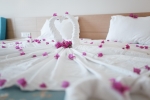 Кровать или кровати в номере L'Oceanica Beach Resort
