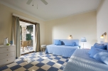 Кровать или кровати в номере Aldemar Olympian Village