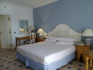 Кровать или кровати в номере Sheraton Sharm Hotel, Resort, Villas & Spa