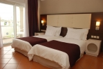 Кровать или кровати в номере Kenzi Europa