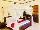 Кровать или кровати в номере Arya Amed Beach Resort and Dive Center