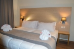 Кровать или кровати в номере Anezi Tower Hotel