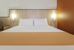 Кровать или кровати в номере Ibis Al Barsha