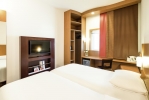 Кровать или кровати в номере Ibis Fujairah