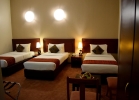 Кровать или кровати в номере Nejoum Al Emarat