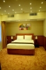 Кровать или кровати в номере Nejoum Al Emarat