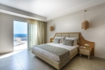 Кровать или кровати в номере Cronwell Resort Sermilia Ultra All-Inclusive