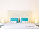 Кровать или кровати в номере Grecotel Margo Bay and Club Turquoise