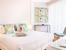 Кровать или кровати в номере Grecotel Margo Bay and Club Turquoise