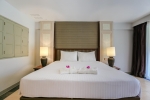Кровать или кровати в номере Phuket Orchid Resort and Spa