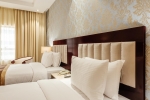 Кровать или кровати в номере Tulip Inn Al Khan Hotel