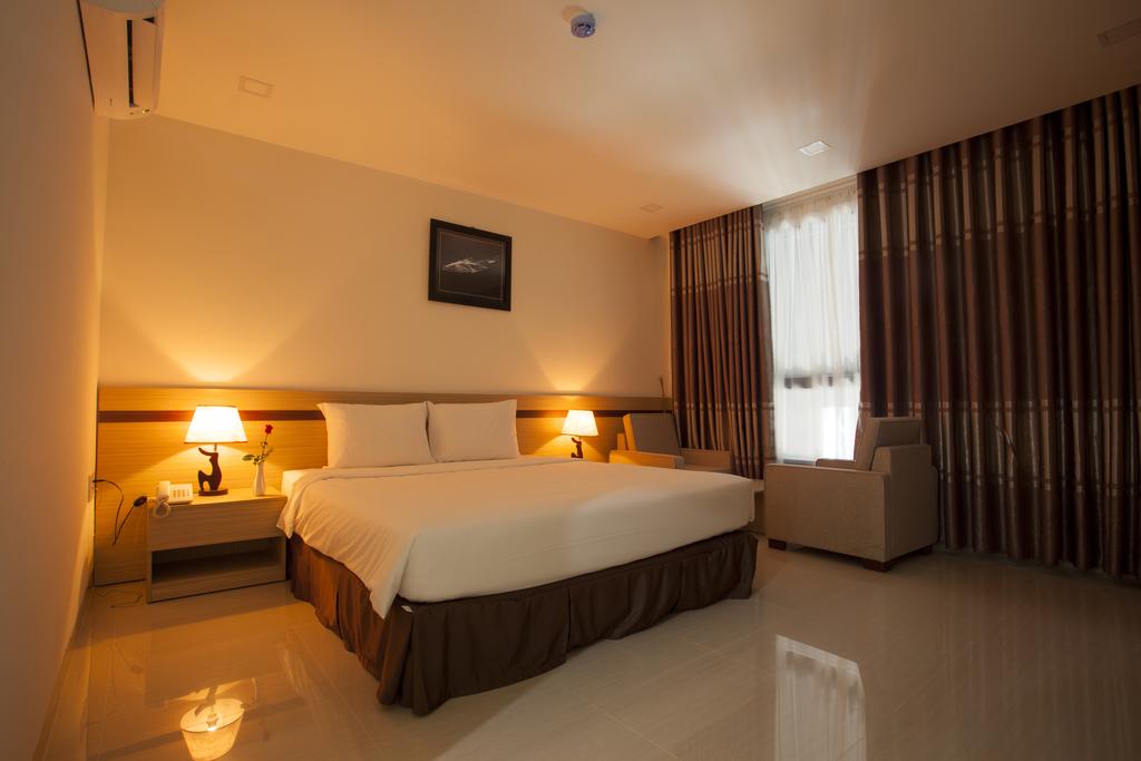 Отель Кровать или кровати в номере Melody Hotel