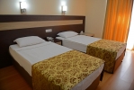Кровать или кровати в номере Lonicera World