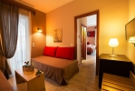 Кровать или кровати в номере Kyparissia Beach Hotel
