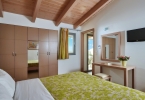 Кровать или кровати в номере Panormo Beach Hotel