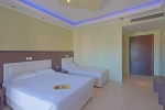 Кровать или кровати в номере Grand Platon Hotel