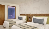 Кровать или кровати в номере Parklane, a Luxury Collection Resort & Spa, Limassol