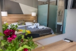 Кровать или кровати в номере Exotica Hotel & Spa by Zante Plaza