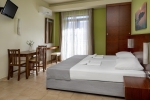 Кровать или кровати в номере Oscar Suites & Village