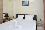 Кровать или кровати в номере Villa Sardinia Apartments 