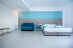 Кровать или кровати в номере Mandali Hotel