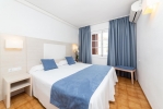 Кровать или кровати в номере Apartamentos Casa Vida 