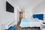 Кровать или кровати в номере Hotel Roc Leo