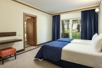 Кровать или кровати в номере Maritim Pine Beach Resort