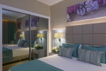 Кровать или кровати в номере Asia Beach Resort & Spa Hotel