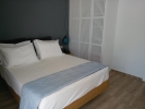 Кровать или кровати в номере Meropi Hotel & Apartments