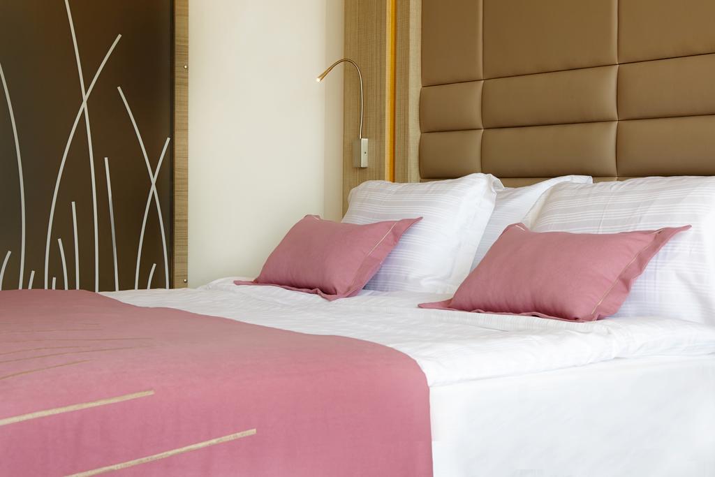 Отель Кровать или кровати в номере Sentido Orka Lotus Beach