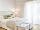 Кровать или кровати в номере Grecotel Lux Me Rhodos