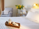Кровать или кровати в номере Grecotel Meli Palace