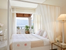 Кровать или кровати в номере Grecotel Eva Palace