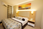 Кровать или кровати в номере Blue Wave Suite Hotel