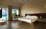Кровать или кровати в номере Cocoon Maldives
