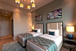 Кровать или кровати в номере Rixos The Palm Hotel & Suites
