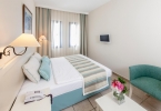 Кровать или кровати в номере Bodrum Park Resort Ultra All Inclusive