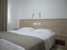 Кровать или кровати в номере Senator Hotel Apartments 