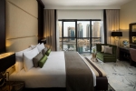 Кровать или кровати в номере Millennium Place Dubai Marina