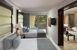 Кровать или кровати в номере The Reserve at Paradisus Palma Real - Все включено