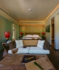 Кровать или кровати в номере Dhevatara Beach Hotel